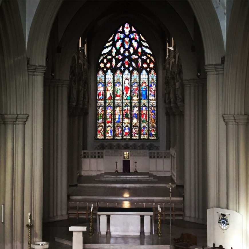 An image of the crossing sanctuary and cathedral altar,with the cathedra to the right