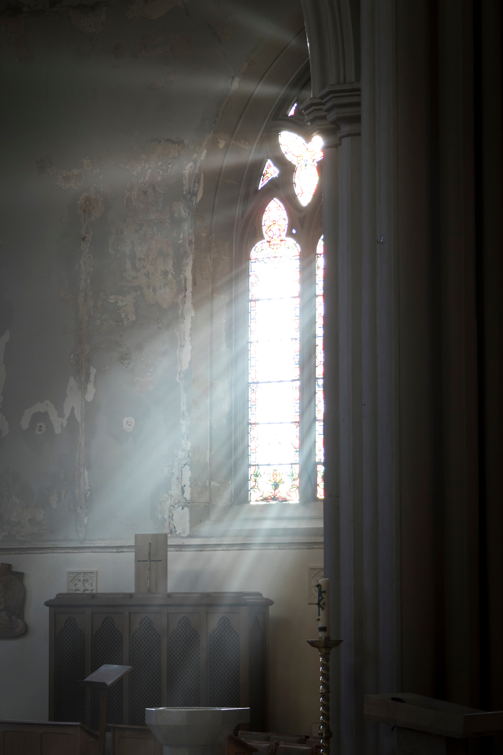A Photograph showing A wonderful view of the sun shining through the side window pouring light into the cathedral